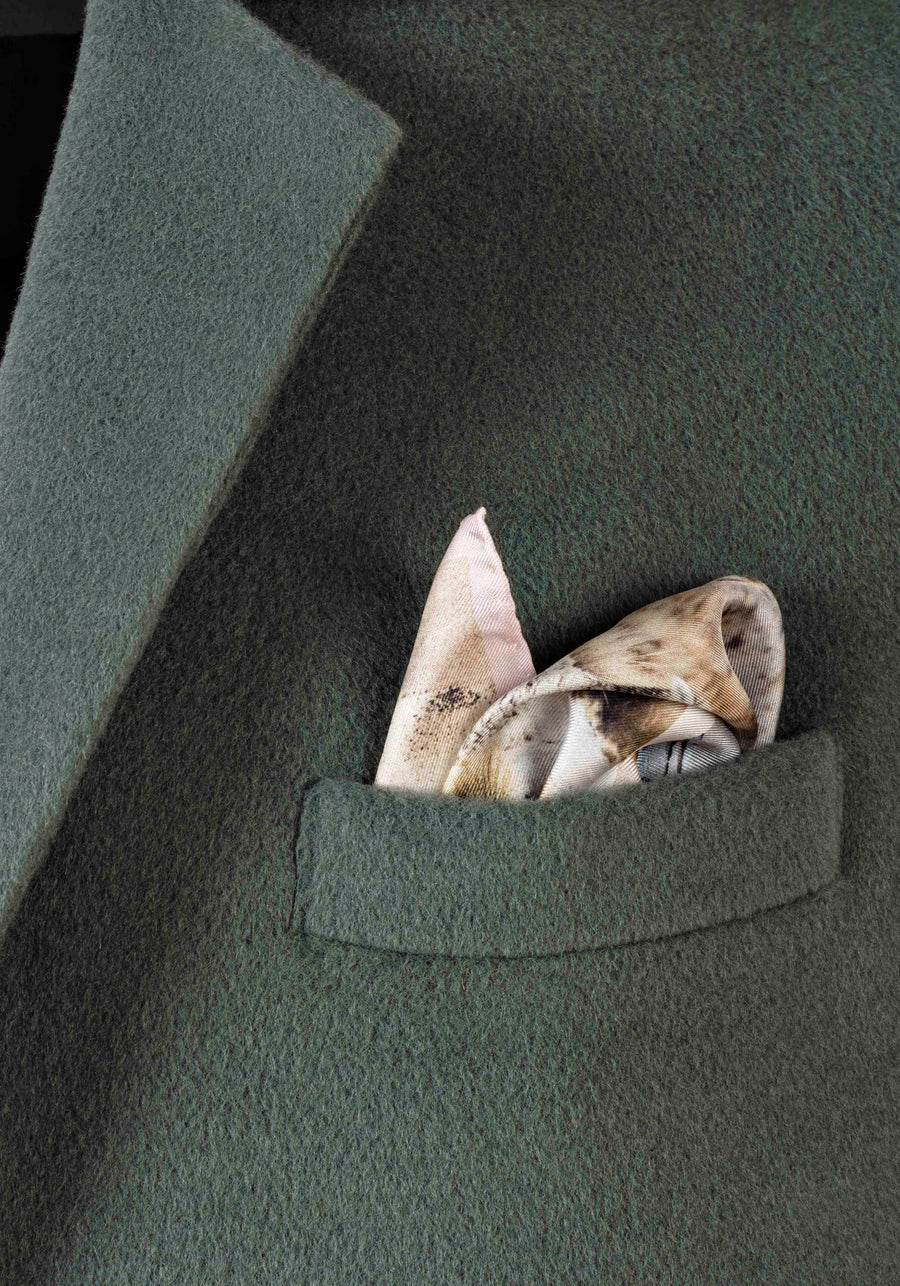 AQVAROSSA CATACAOS Silk Pocket Square in colour open sand close up in jacket pocket